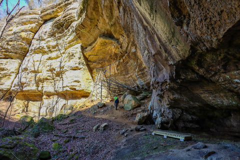 hikers climbing beneath the tobacco curing racks of tobacco cave on the lower trails of jeffreys cliffs