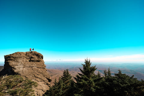 hikers celebrating summit of macrae peak on grandfather mountain