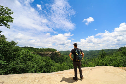 Hiker Looking out from the top of natural bridge to lookout point in natural bridge state resort park kentucky