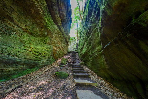 Hiking through fat woman’s passage in Cantwell cliffs trails of Hocking hills state park ohio