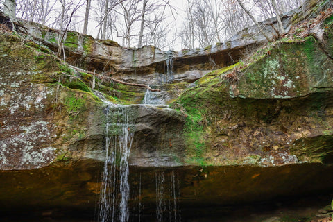 Up close view of bowl shaped waterfall in yellow birch ravine nature preserve Indiana 