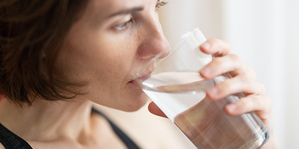 Woman drinking a glass of water