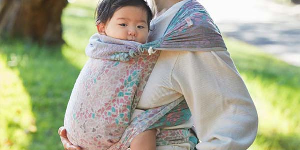 Mom carrying baby in a woven wrap carrier