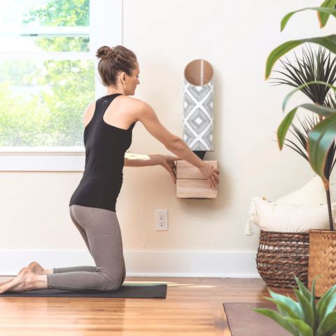 Wall yoga storage by Mache