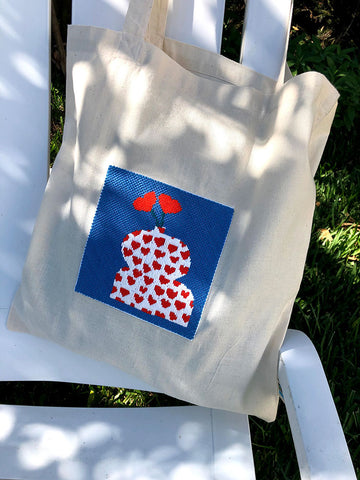 totebag with needlepoint insert of vase with flowers