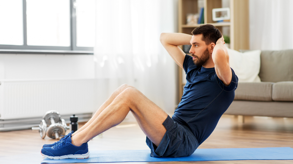 Man Making Abdominal Exercises at Home