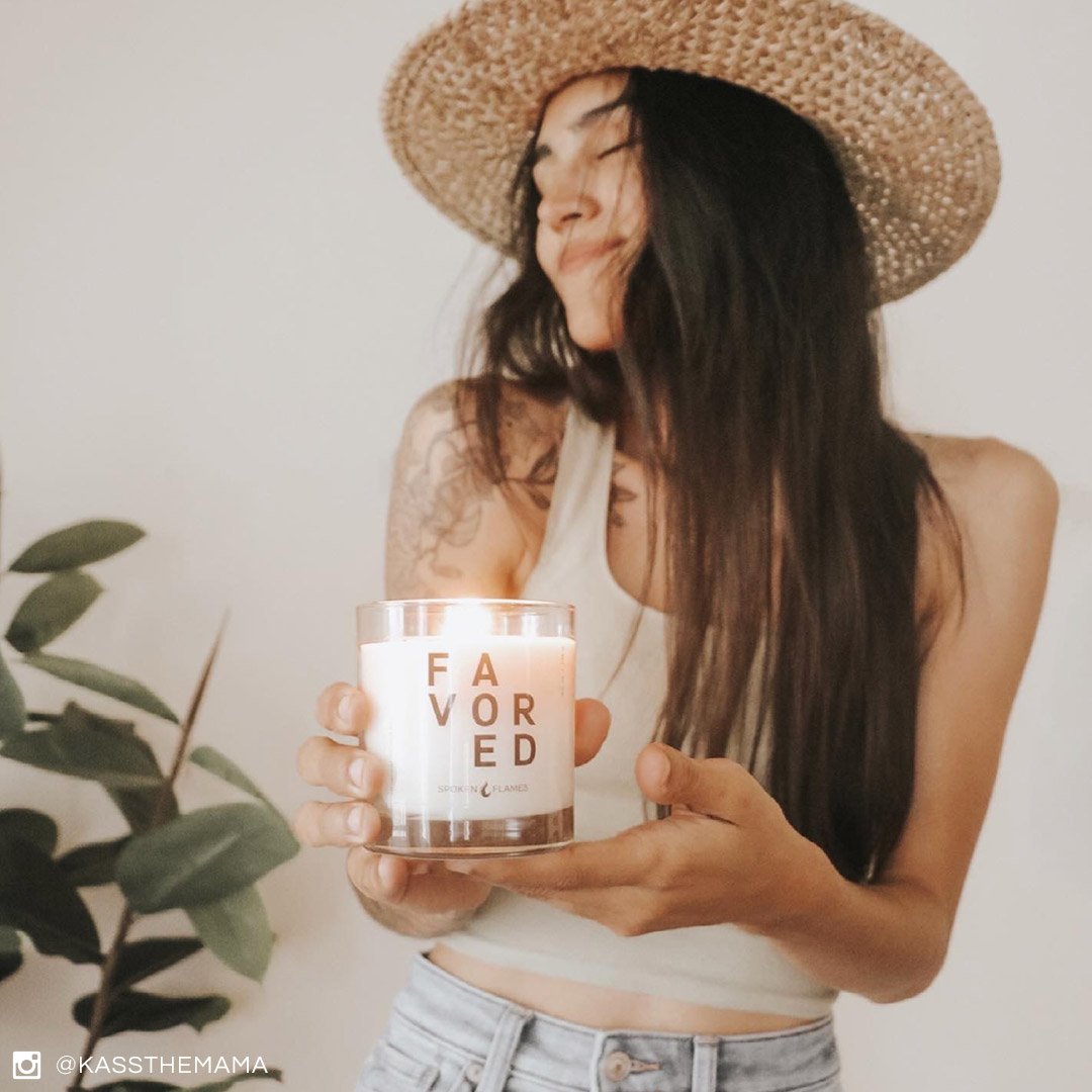 Woman holding Spoken Flames' Favored Candle