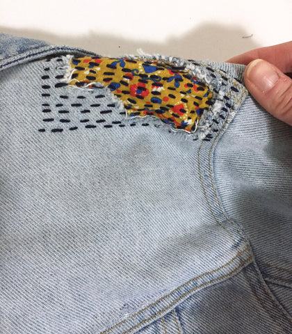 Sewing a patch onto damaged furniture : r/Visiblemending