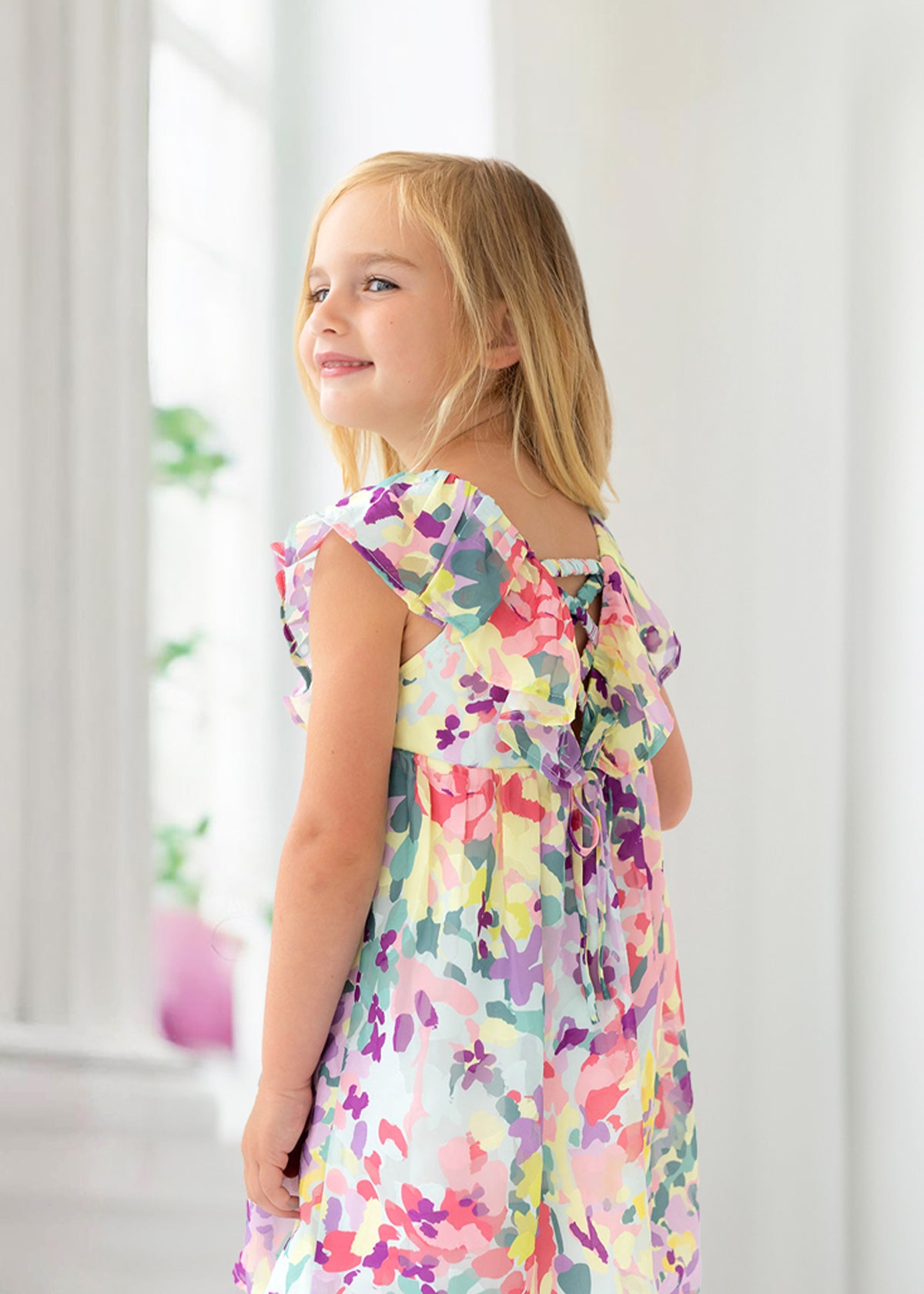 Girl wearing colorful easter dress