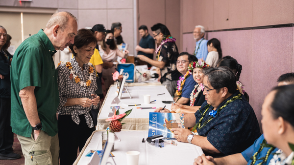 crowd lined up to have contributors to the CHIBURU anthology sign their books