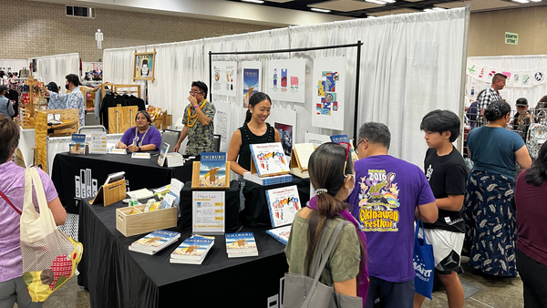 attendees and vendor at the Okinawan Festival