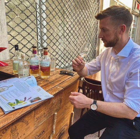 Ben nosing whisky at a bar