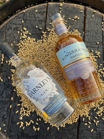 Darnley's Gin and Kingsbarns Doocot side by side on a bed of barley