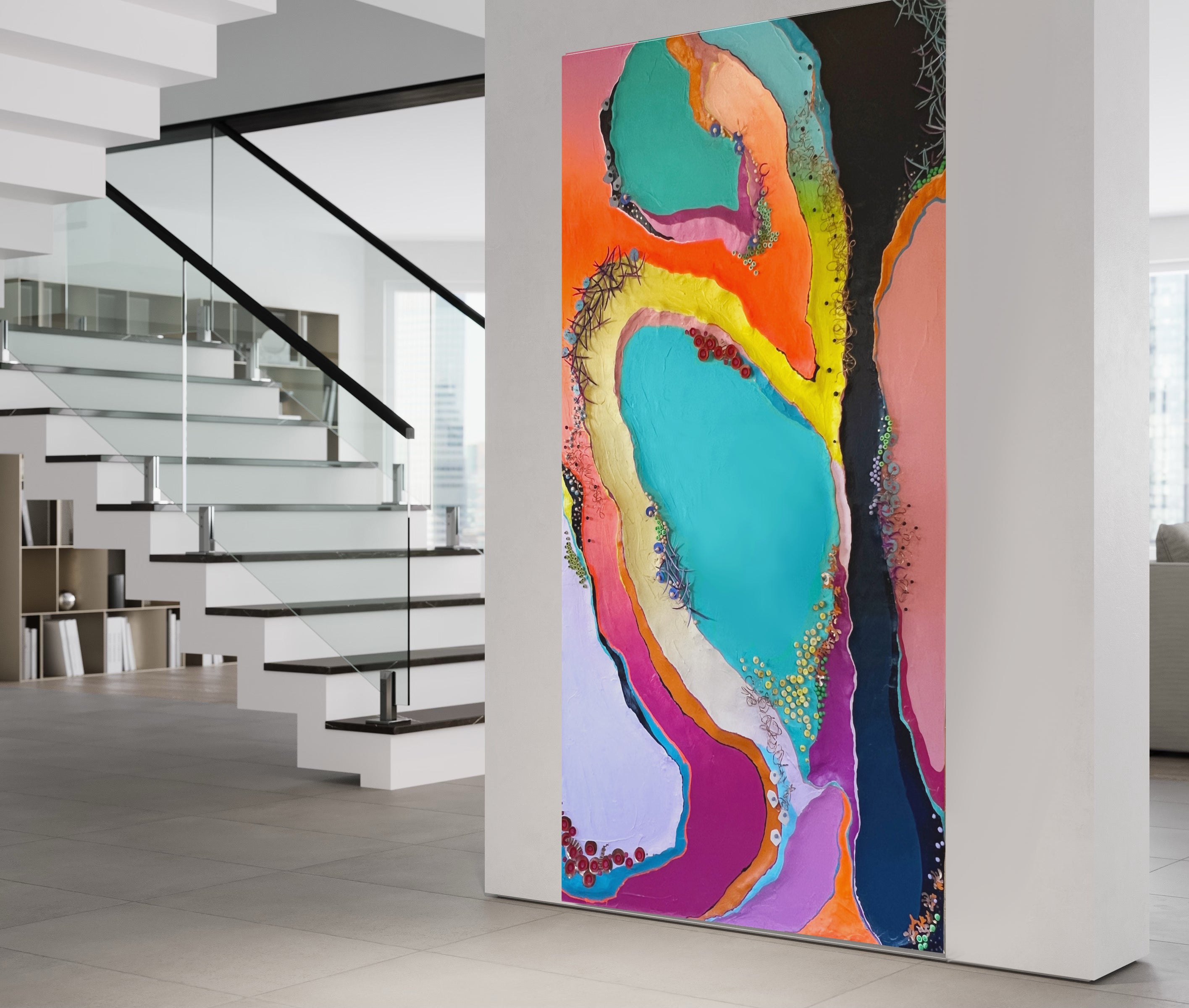 Large colorful abstract sculptural mural on an office wall that is 12x8 feet in size with stairs in the background