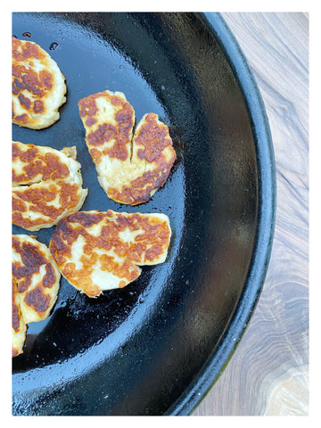 Halloumi in a cast iron frying pan 