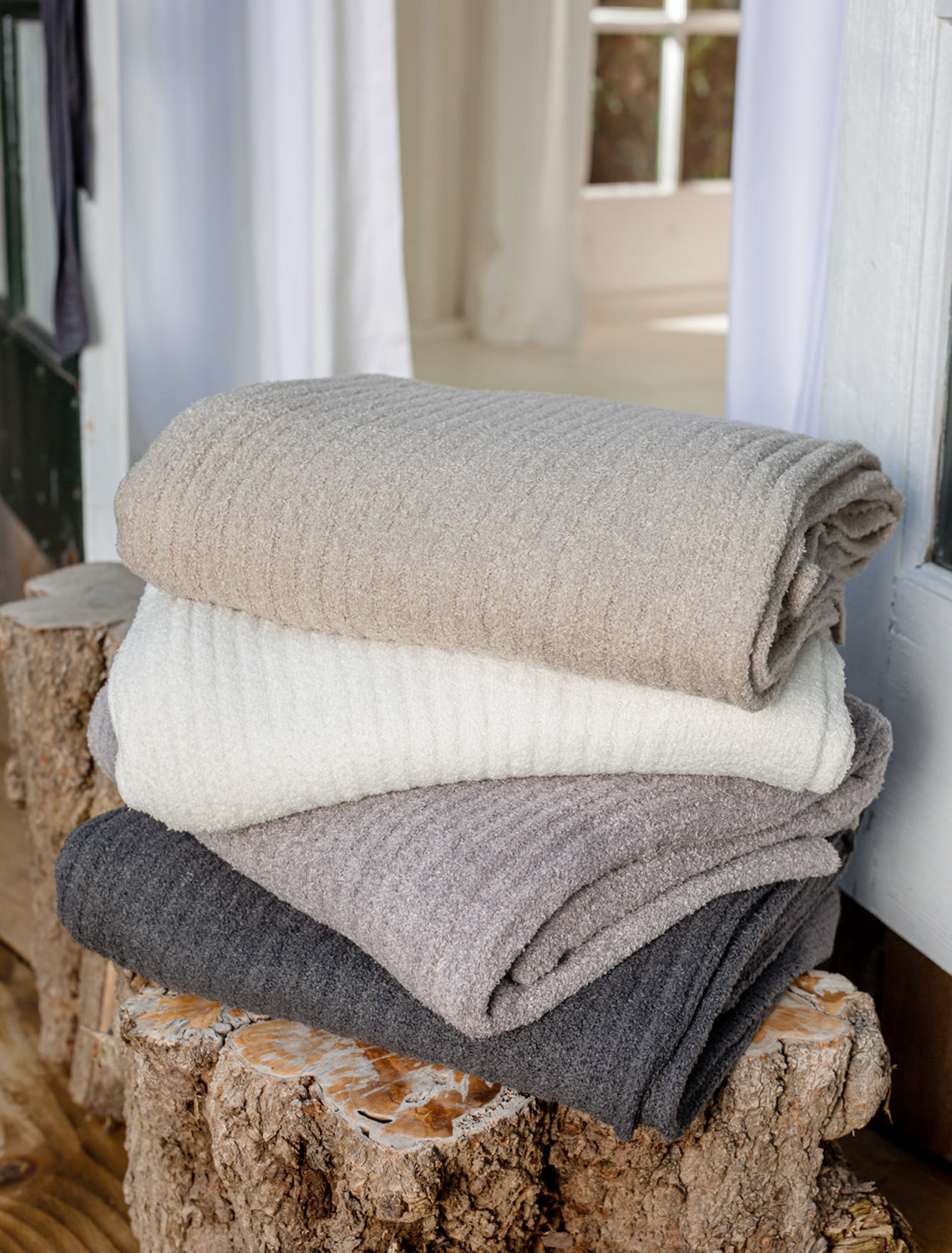 Get Cozy With 60% Off Barefoot Dreams Deals: Sweaters, Blankets & More