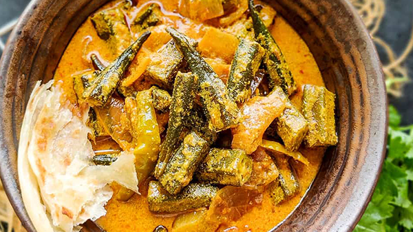  It is a popular North Indian dish that consists of okra cooked in a tangy yogurt-based sauce. 