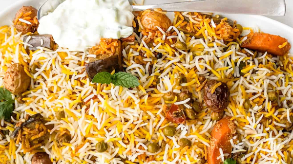 Vegetable Biryani is a flavorful Indian rice dish made with aromatic spices, vegetables, and sometimes nuts and dried fruits. 