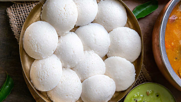 Idli is a soft, pillow steamed savory cake made from rice and lentil batter