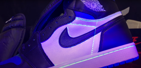 Air Jordan 1 High Fake Sneakers under UV light