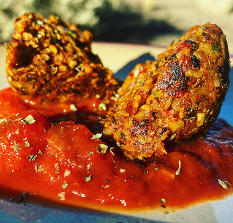 Cumin Pumpkin Seed Balls with Tomato Sauce 