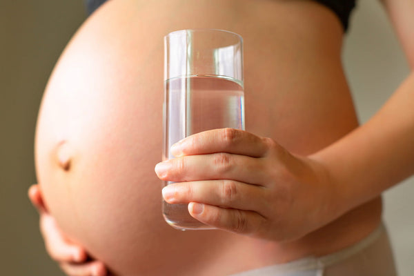 Drinking adequate fluids daily supports a healthy pregnancy.