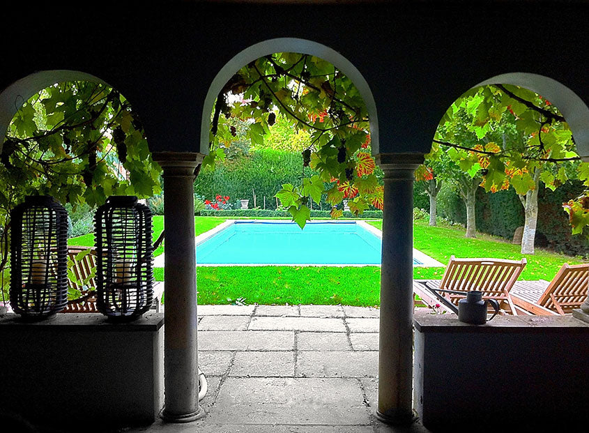 Swimming pool view through arches