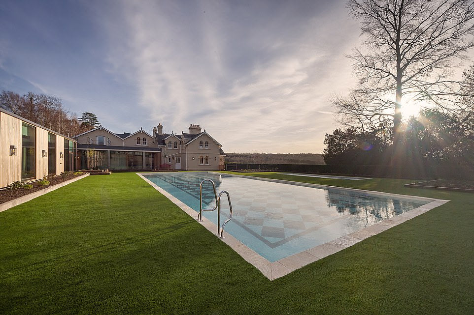 Stunning chequerboard tiled pool with an immaculate lawn surround