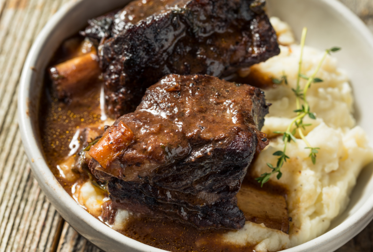 short ribs and mashed potatoes in a bowl cooked with Auntie Nonos 