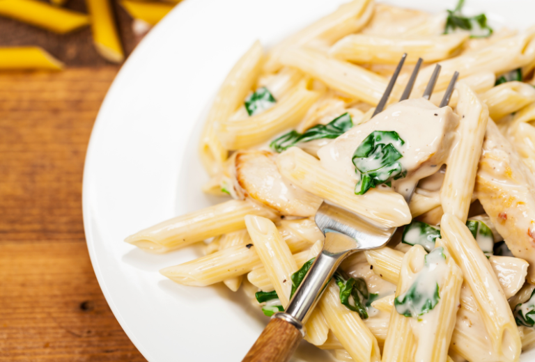 creamy chicken parmesan pasta in a bowl 