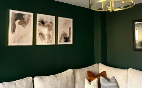 3 piece gallery set on green living room wall.