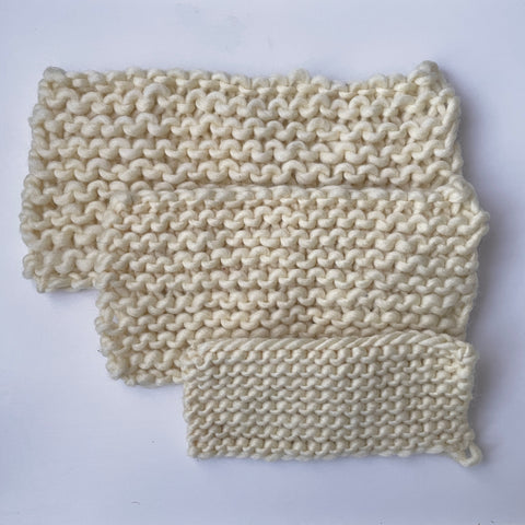 3 knitted swatches using the same yarn, and 3 different knitting need sizes
