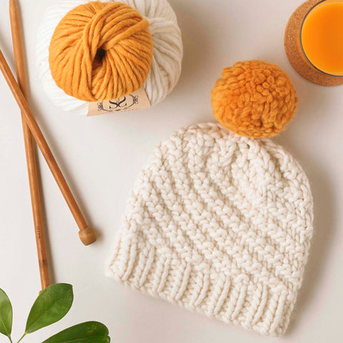 Luca Pom Hat knitting kit with mustard yellow pom pom