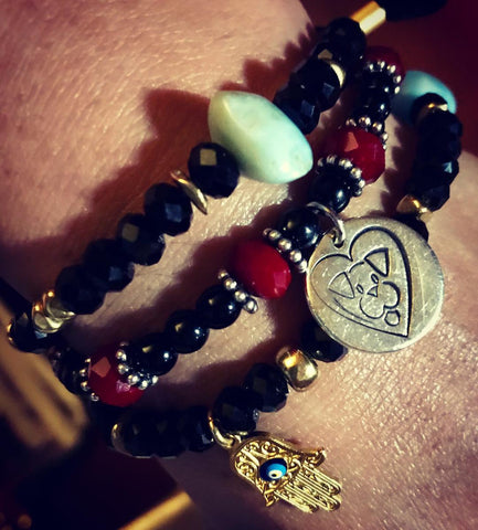 Stackable bracelets featuring Amy Delson's custom made Stray from the Heart bracelet