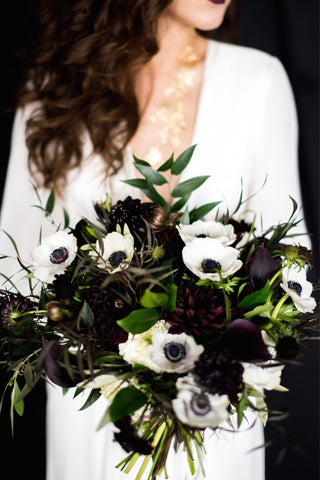 White and black bridal bouquet anemone and calla lilies