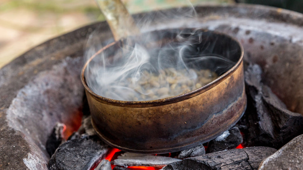 Closeup of traditional coffee roasting technique in Ethiopia.