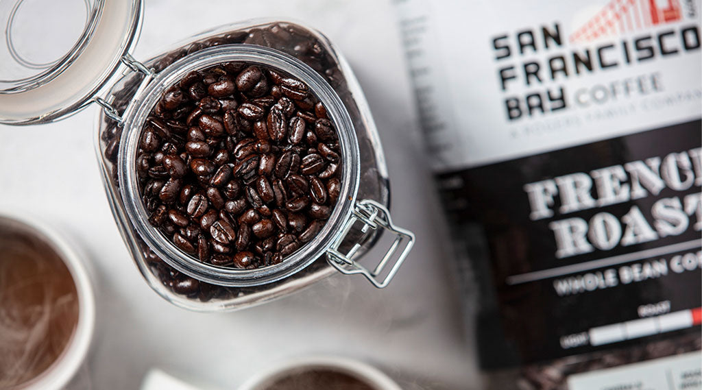 San Francisco Bay Coffee's French Roast Bag with jar of coffee beans.