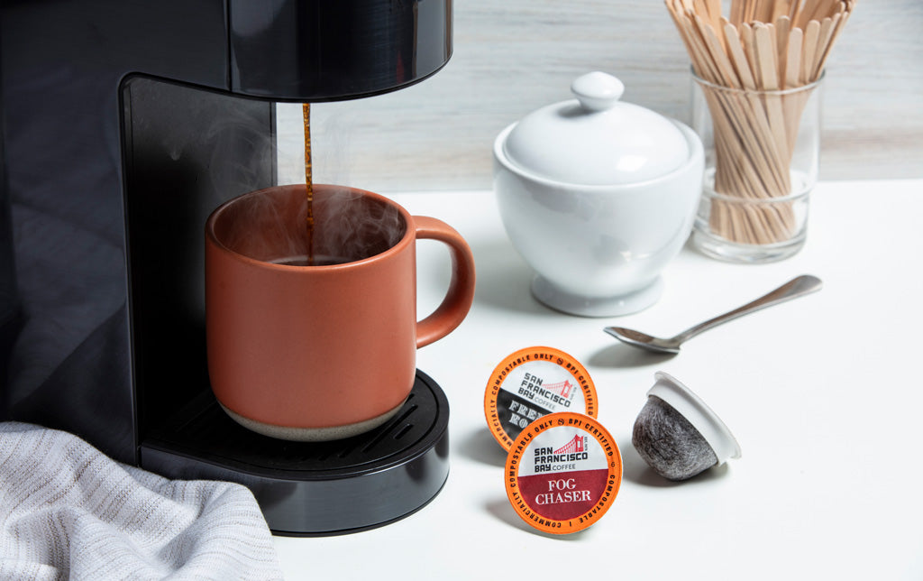Fog Chaser OneCUP coffee pods on kitchen counter.