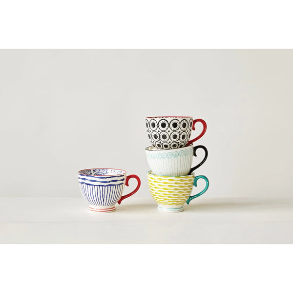 https://cdn.shopify.com/s/files/1/0271/1843/6426/products/hand-stamped-stoneware-mug-384642_600x600.webp?v=1648169410