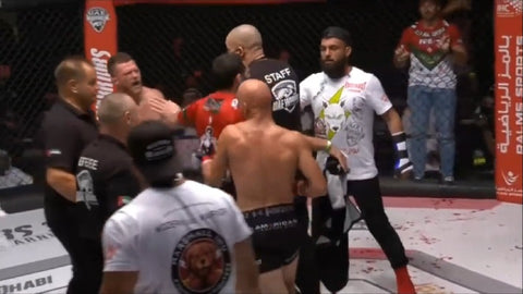 Al Qaisi pursues Arnett after the bout enraged by the stoppage.