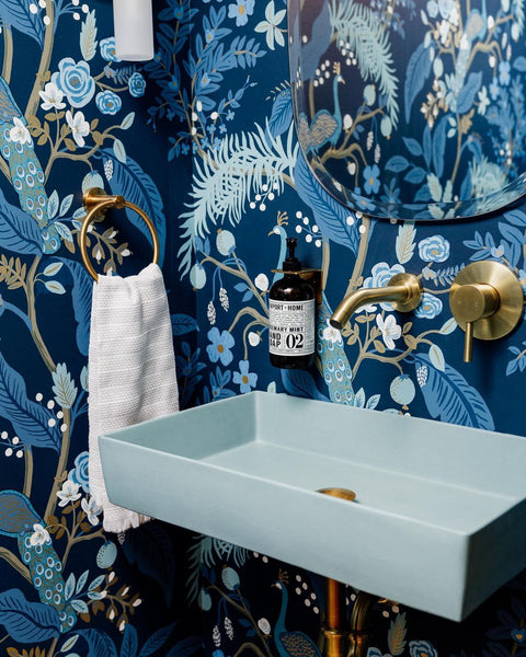 Blue aesthetic interior powder room design featuring Concretti Design sink New York