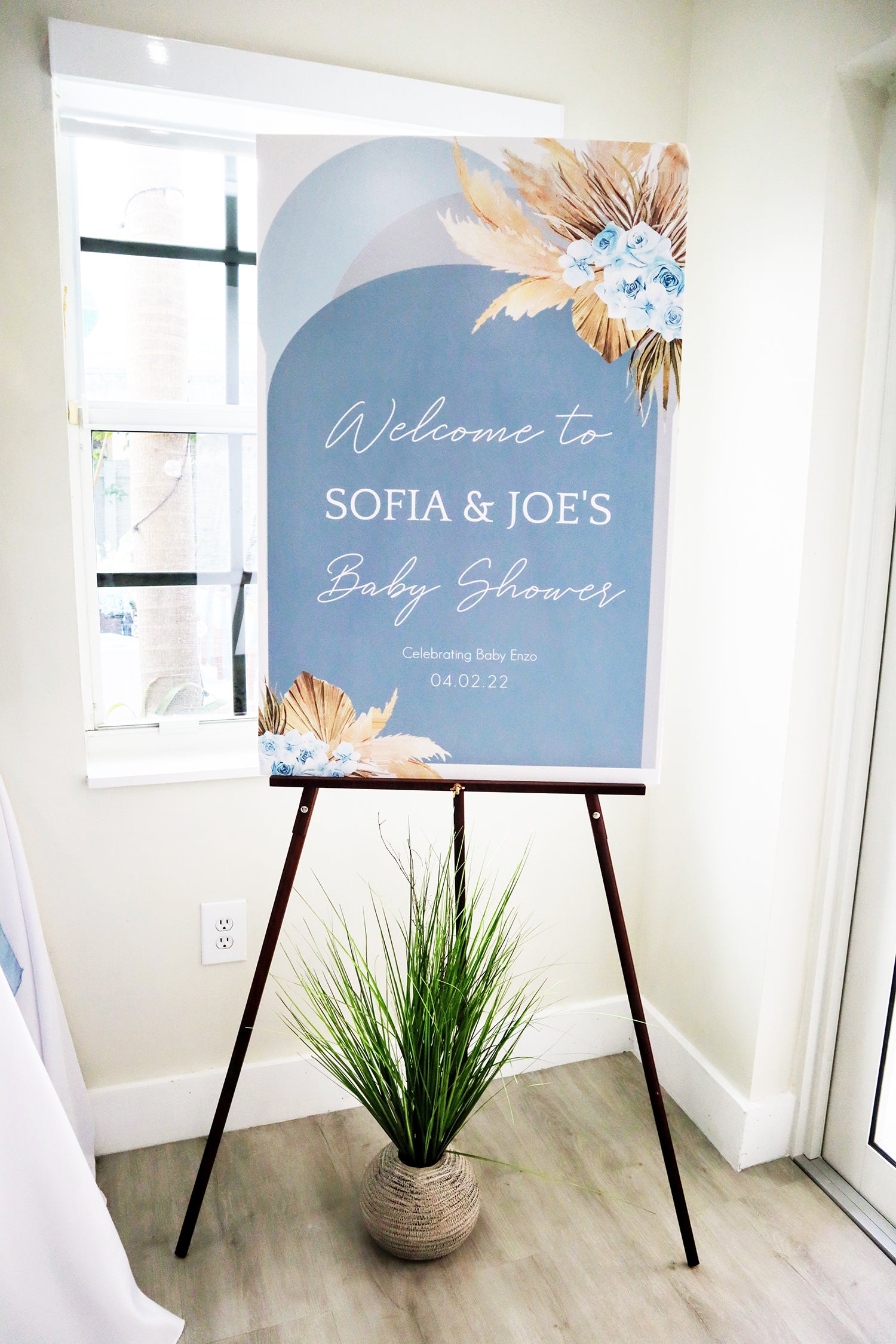 pampas welcome baby shower sign on easel