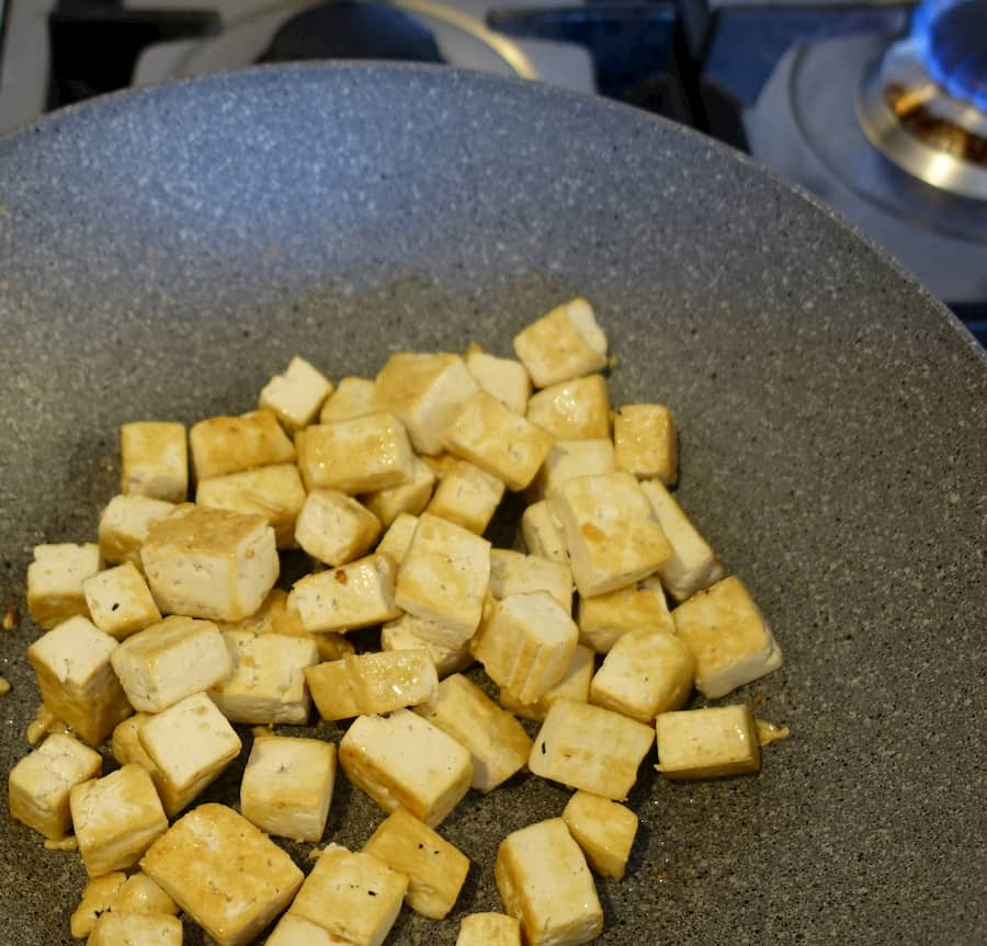 Stir-fry tofu in pan