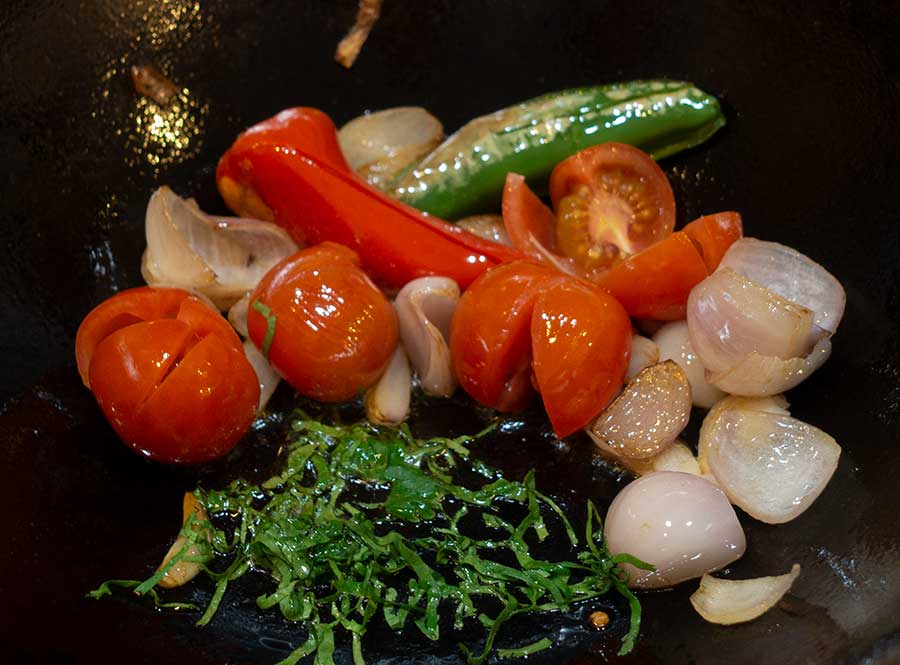 Add-fried-tomatoes-and-chopped-coriander