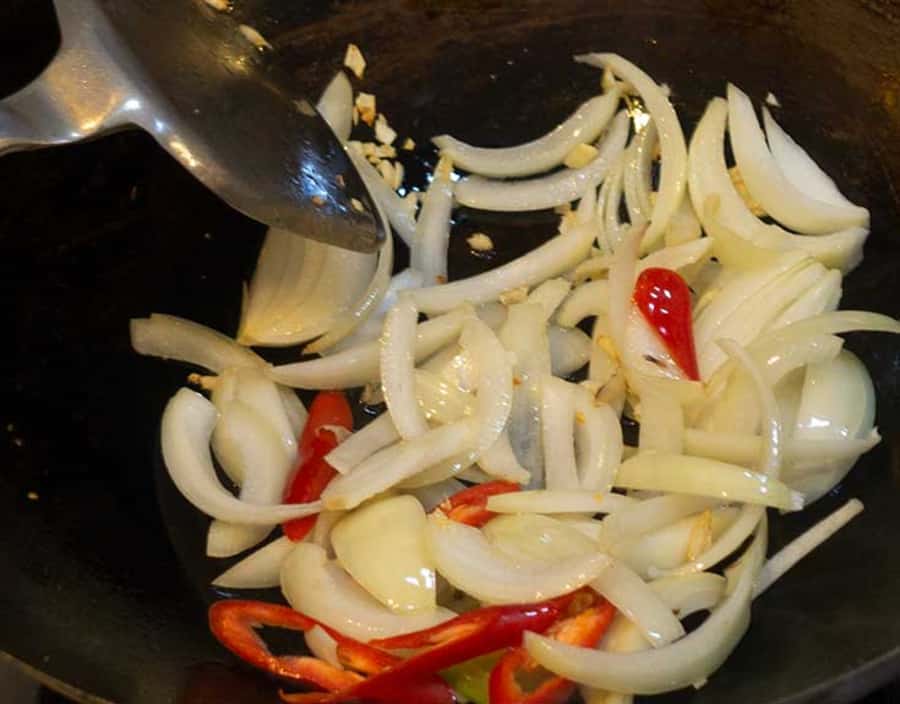 Add chillies to stir fry