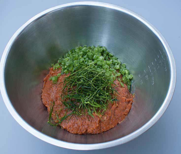 Kaffir lime leaves and green beans with Thai fish cake mix