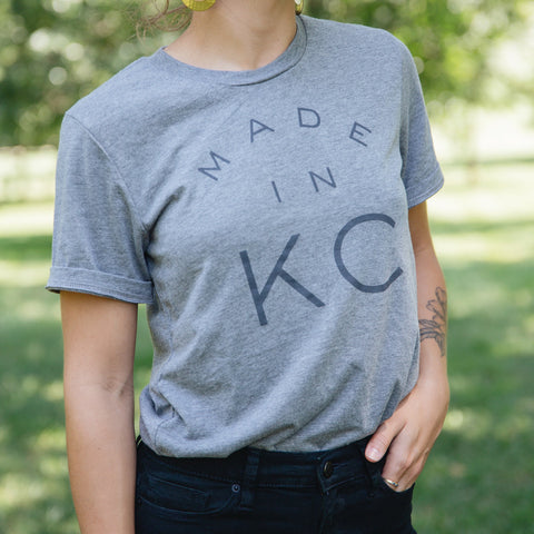 A woman wearing a "Made in KC" shirt