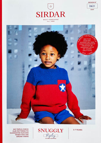 Image of cover of Sirdar knitting pattern showing a young boy wearing a red and royal blue sweater with a breast pocket with a white 5 pointed start motif