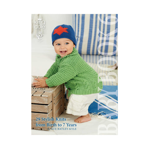 Image of cover of King Cole Baby Book 6 knitting pattern book featuring a baby with a green knitted jacket and blue and red hat