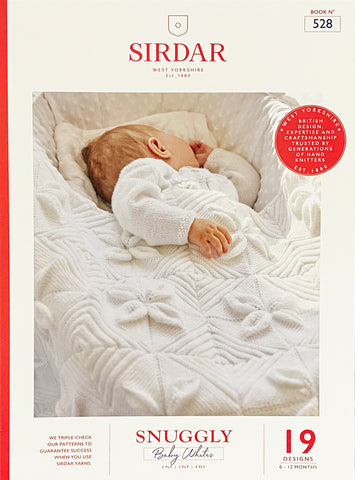 Image of cover of baby knitting pattern book featuring a sleeping baby in a knitted jacket with a knitted blanket in white yarn